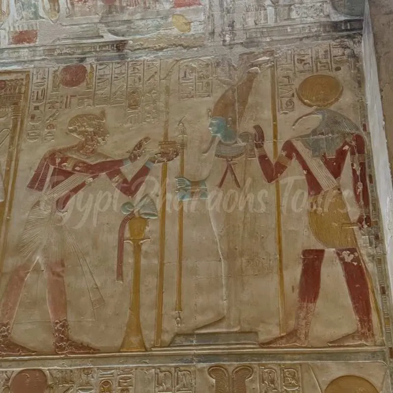 Ancient Egyptian hieroglyphics and wall carvings inside the Temple of Seti I at Abydos